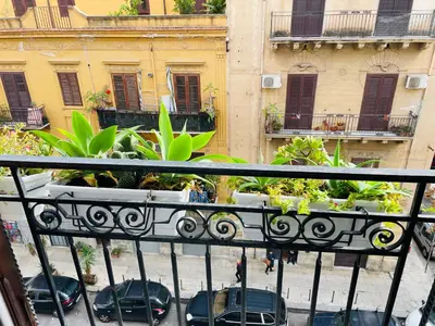 a balcony with a view of a city at Funky flat in Palermo