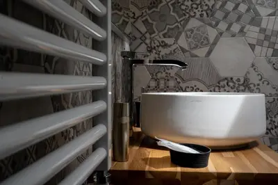 a bathroom with a sink and a faucet at Residence Salinelle Beach Villa Vulcano 4 in Lascari