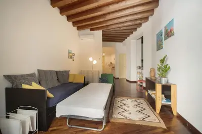 a living room with a couch and a table at Casa Linda in Palermo