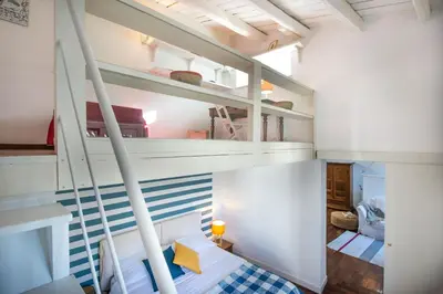 a bedroom with two bunk beds in a room at Terrazza al Capo by Wonderful Italy in Palermo
