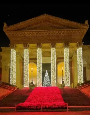 a large building with a christmas tree in the middle at Amalfitani House in Palermo