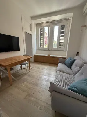 a living room with a couch and a table at B&B Babbaluci - Centro Storico in Palermo