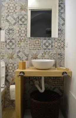 a bathroom with a sink and a mirror at Antico vicolo di ballarò in Palermo