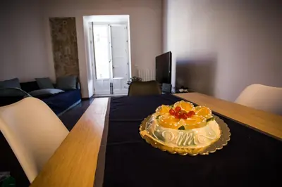 a cake sitting on top of a wooden table at A Casa del Genio in Palermo