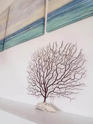 a drawing of a tree on a wall at villa coral mondello in Palermo