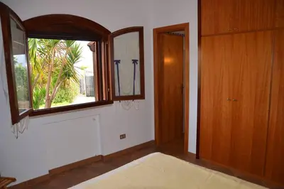 an empty room with a window and a door at Villa Fraginesi in Castellammare del Golfo