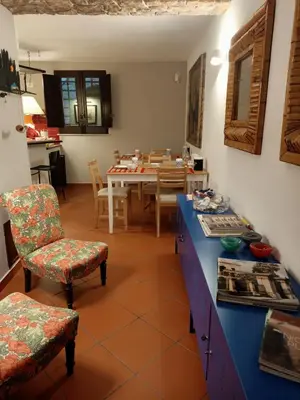 a kitchen and dining room with a table and chairs at Mix&Match in Palermo