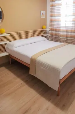 two twin beds in a bedroom with a window at Elite Residence Mondello in Mondello