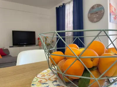 a bowl of oranges sitting on a table at Elite Residence Mondello in Mondello