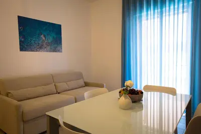 a living room with a couch and a table at Casa Vacanza Barone in Castellammare del Golfo