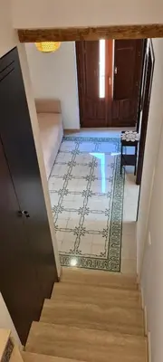 a hallway with a staircase with a tile floor at Voltamare in Castellammare del Golfo