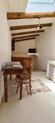 a dining room with a wooden table and a table sidx sidx sidx at Voltamare in Castellammare del Golfo