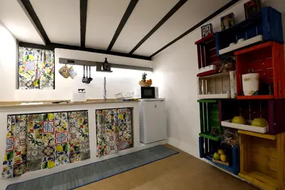 a kitchen with a counter and a refrigerator at Il Siciliano home in Palermo