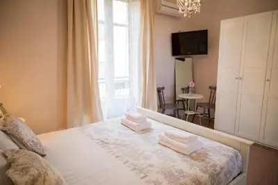 a bedroom with a bed with towels on it at B&B Abbacò in Palermo
