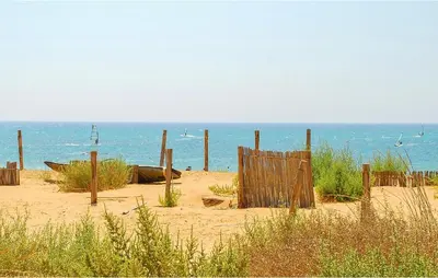 a wooden fence in the sand on the beach at Stunning Home In Castellammare Del G in Castellammare del Golfo