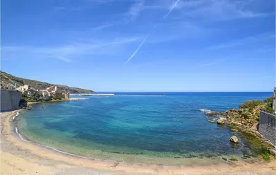 a view of a beach with blue water at Stunning Home In Castellammare Del G in Castellammare del Golfo