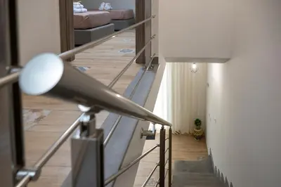 a room with a staircase with a light and a lamp at Residence Salinelle Beach Villa Salina 5 in Lascari