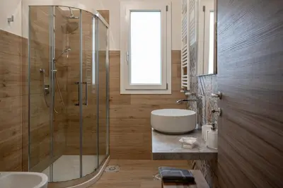 a bathroom with a shower and a sink and a tub at Residence Salinelle Beach Villa Salina 5 in Lascari