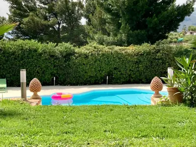a swimming pool with a frisbee and a frisbeephasis at Loft - Villa Flore apartments in villa in Casteldaccia