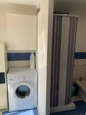 a washing machine in a bathroom with a shower at home.70 Carini in Palermo