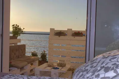 a view of the ocean from a room with a window at Sea view life in Carini