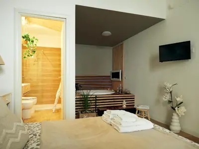 a bedroom with a bed and a bath room at Sea view life in Carini