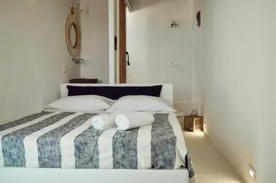 a bedroom with a bed with two towels on it at Sea view life in Carini