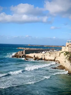 a view of the ocean with rocks in the water at Inkantu B&B in Terrasini