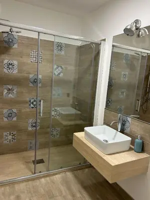 a bathroom with a sink and a shower at Villa DANAE in Mondello