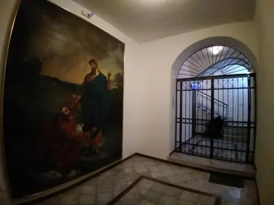 a painting on the wall in a room with a gate at Il mio posto ai Quattro Canti - Centro storico Palermo in Palermo