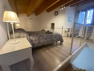 a bedroom with a bed and a table with a lamp at Il mio posto ai Quattro Canti - Centro storico Palermo in Palermo