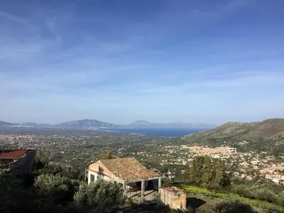 a house on a hill with a view of a city at Villa Calcerame in Montelepre