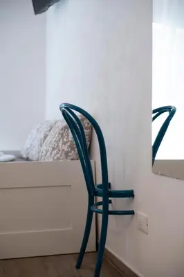 a bedroom with a bed and a television on a wall at Carrettieri54 - apartment historic center Palermo in Palermo
