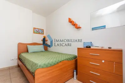 a small bedroom with a bed and a dresser at Villa Pietro in Lascari