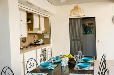 a dining room with a table with blue dishes on it at Airport sicily home palermo in Carini
