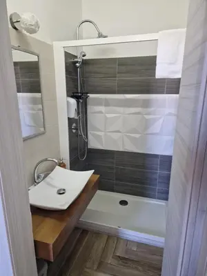 a bathroom with a sink and a shower at Calypso Il Binario Elegance in Palermo