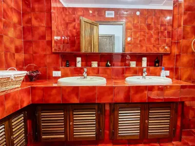a room with a mirror and a chair and a dresser at CASA DEL CORSO in Cinisi