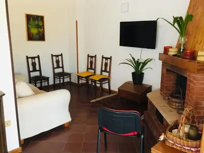 a living room with a couch and a fireplace at CASA DEL CORSO in Cinisi