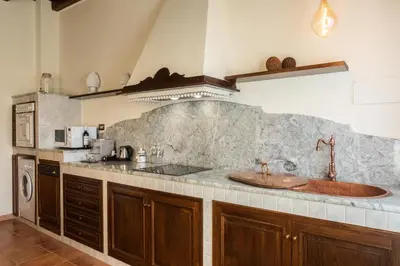 a kitchen with a sink and a counter top at Appartamenti Porto Antico La Cala in Palermo