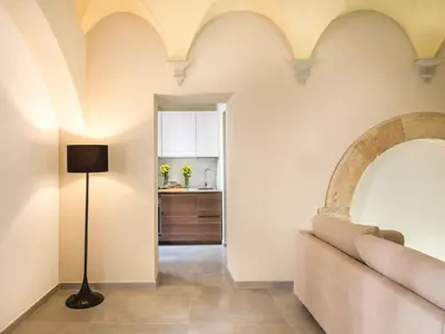 a living room with a couch and a table at Casa dell'Architetto alla Cattedrale by Wonderful Italy in Palermo