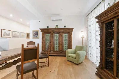 a living room with a couch and a chair at GuestHost - NotHotel Palermo Luxury Guest House in Palermo