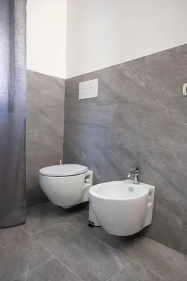 a bathroom with a toilet and a bidet at La casa di Nana’ locazione turistica in Palermo