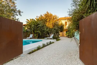 a pool in the backyard of a house at Villa Bienvenue in Carini
