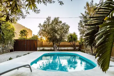 a swimming pool in a yard with a fence at Villa Bienvenue in Carini