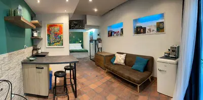 a living room with a couch and a table at ne mia in Palermo