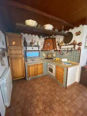 a kitchen with a stove and a counter top at A casa di Eugenio in Carini