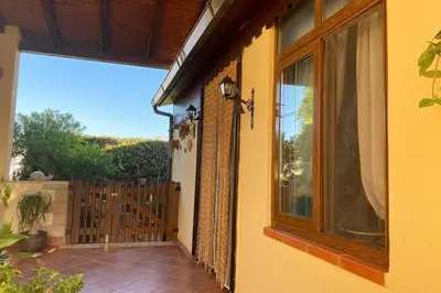 a balcony of a house with a large window at A casa di Eugenio in Carini