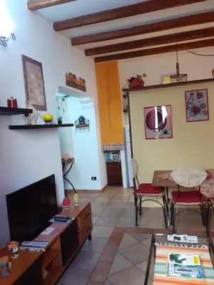 a living room with a tv and a table at Home Casa Professa 1 in Palermo