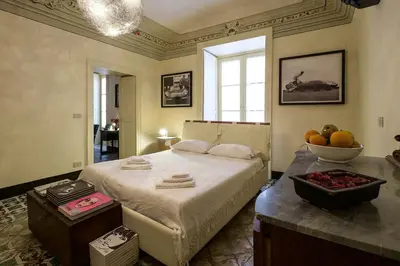 a bedroom with a bed and a bowl of fruit at Casa Particular Luxury in Palermo