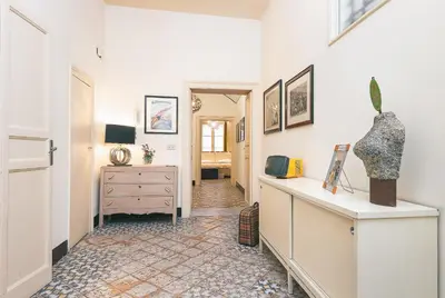 a room with a hallway with white walls and a dresser at Casa Particular Luxury in Palermo